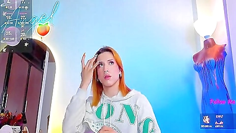 Lingerous beauty with a red head in stockings and a nice tattoo