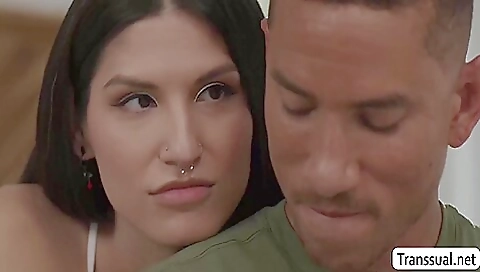 Brunette teen and a guy in a red suit doing bareback